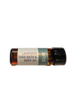 Bottle of lavender sage bath and body oil on a beige background