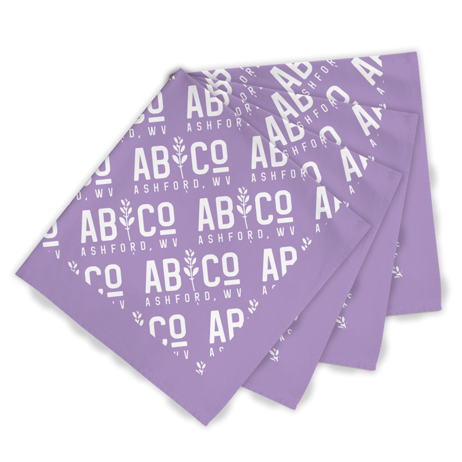 Four purple bandanas with the shortened Appalachian Botanical logo printed repeatedly staggered on top of each other 